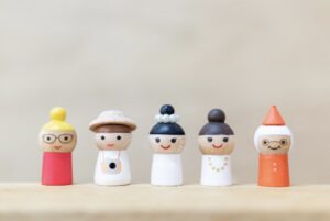 Wooden figures all in a line