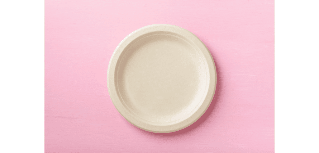 White plate on a pink background