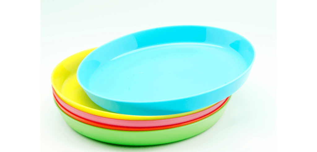 Stack of coloured plastic plates