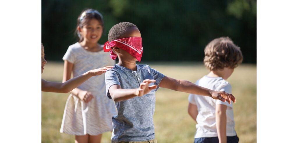 Children playing blind mans bluff