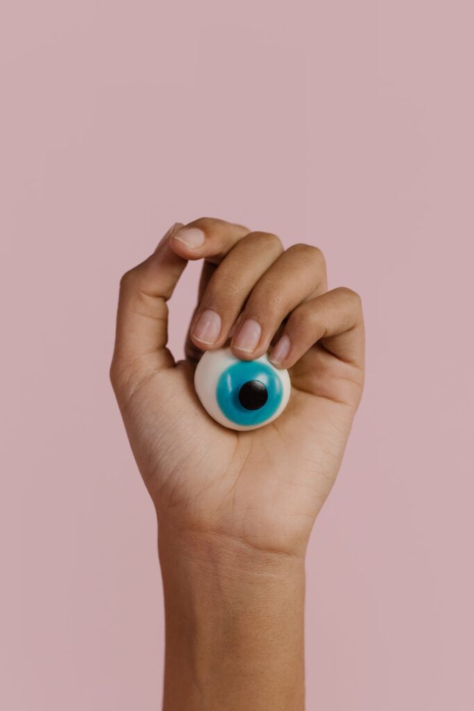 Hand holding an eyeball