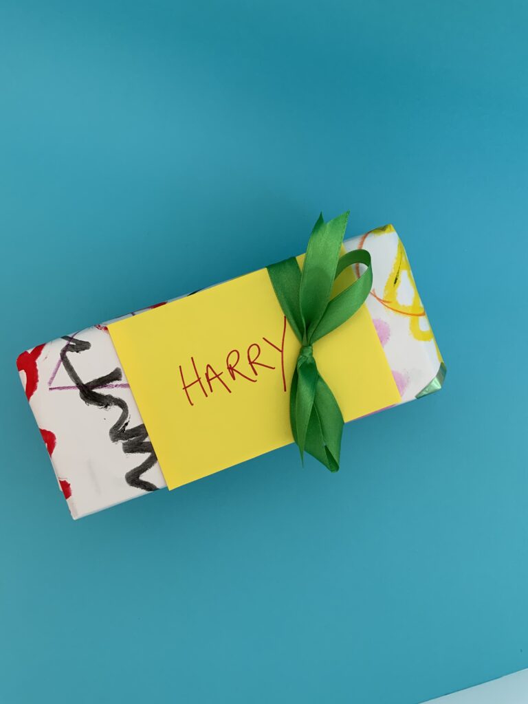 Gift wrapped in child’s paintings