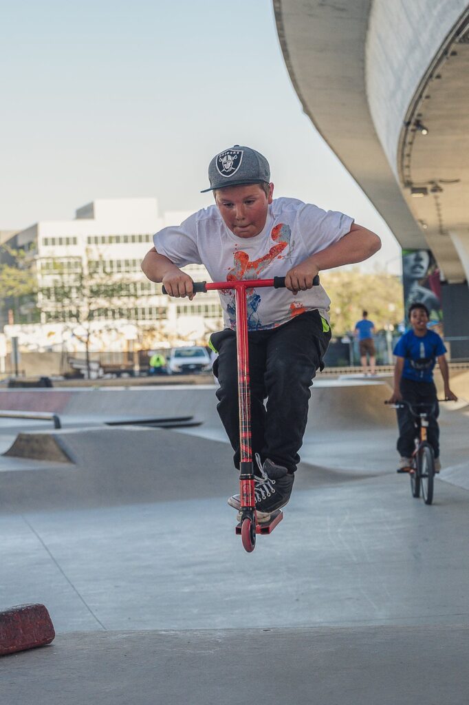 Boy on scooter at skate park