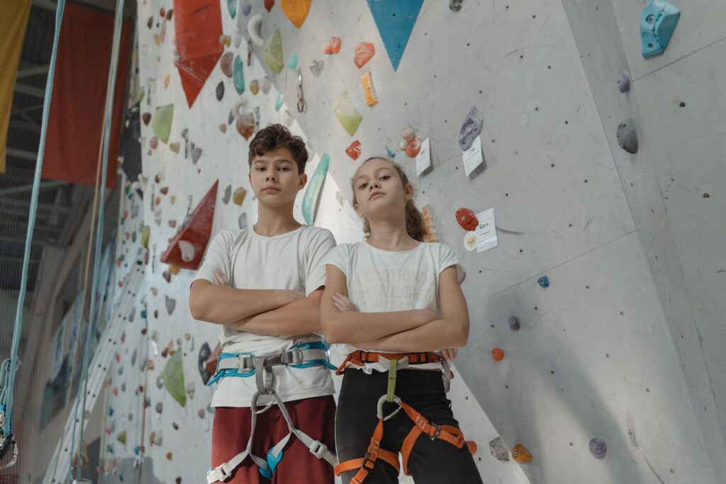 Kids by an indoor climbing wall