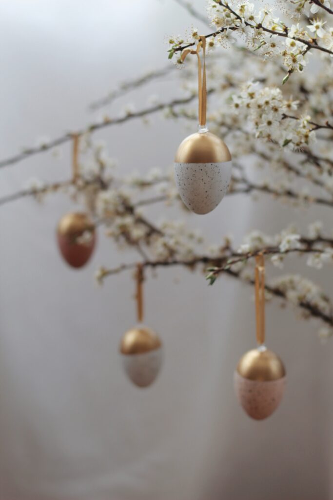Decorated eggs hanging on a tree - Easter celebrations and traditions