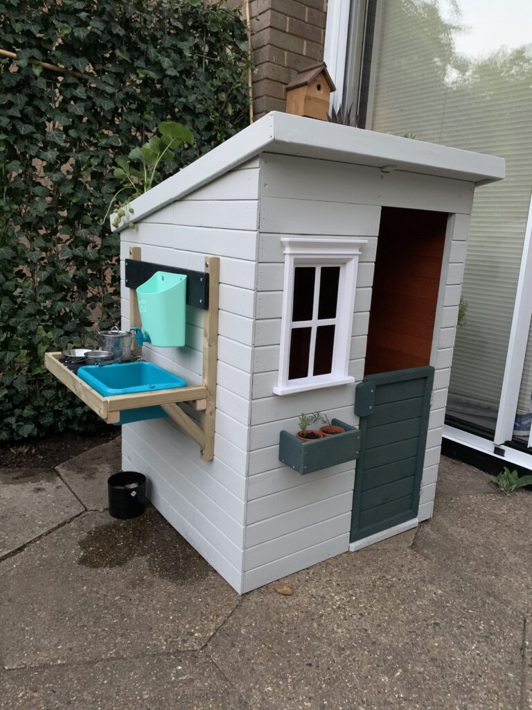 Wooden Wendy house with sink