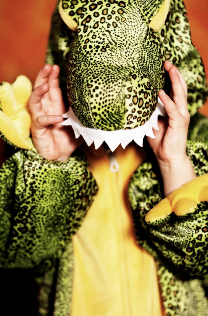 Child in dinosaur costume