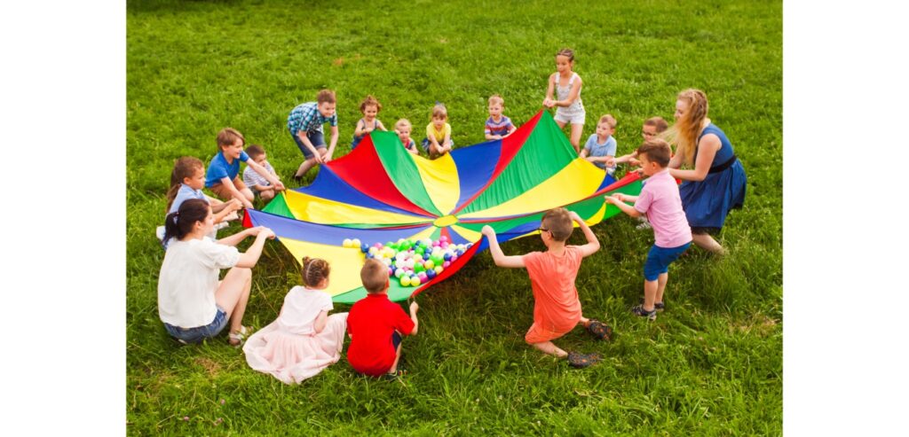 Children playing with parachute in the park