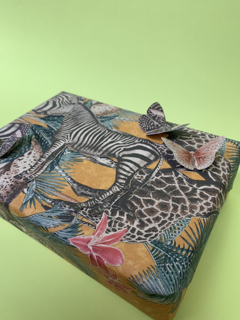 Gift wrapped in zebra jungle wallpaper
