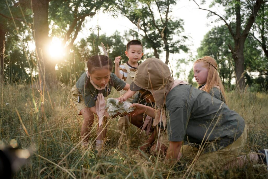 Kids in field geocaching
