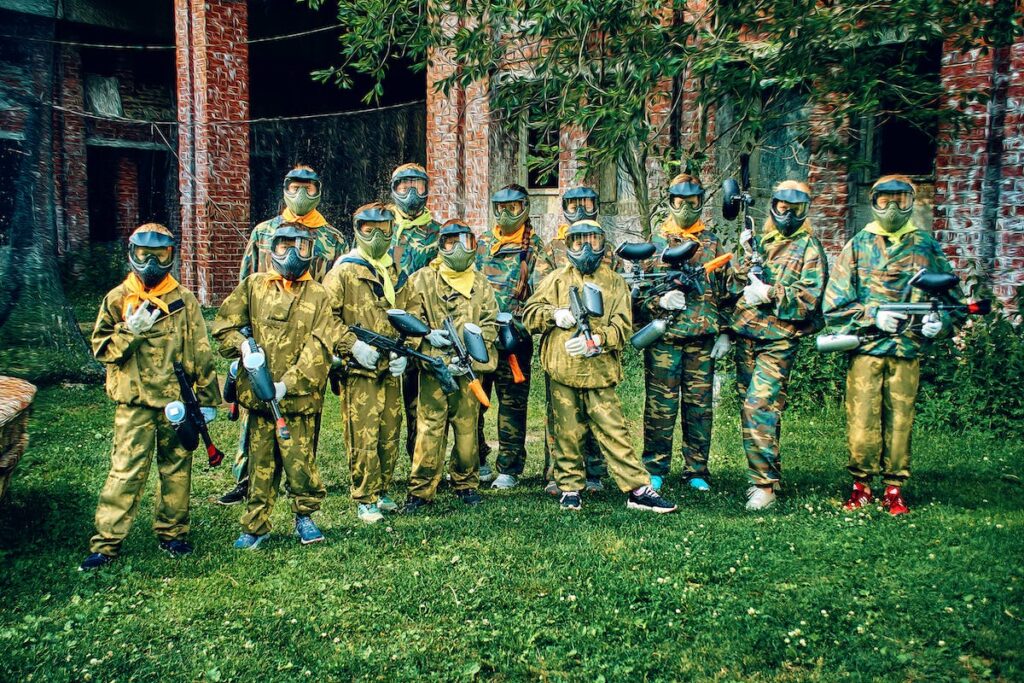Kids dressed in camo gear for paint ball party