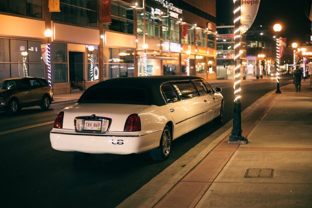 A white limo at night