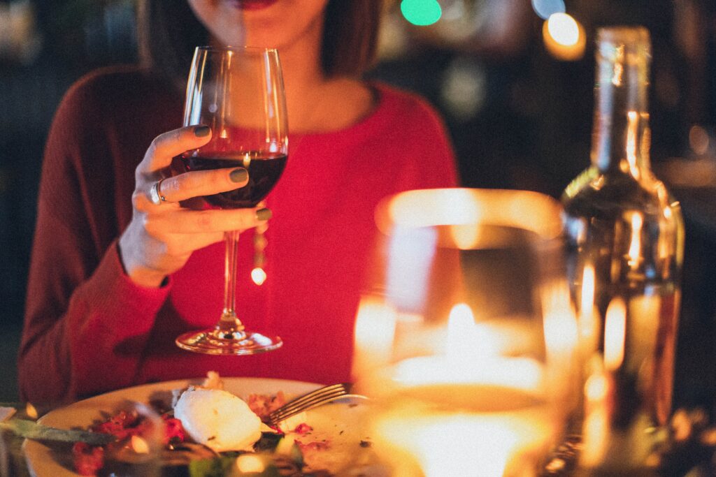 Lady at dinner with wine - Teenage birthday party ideas
