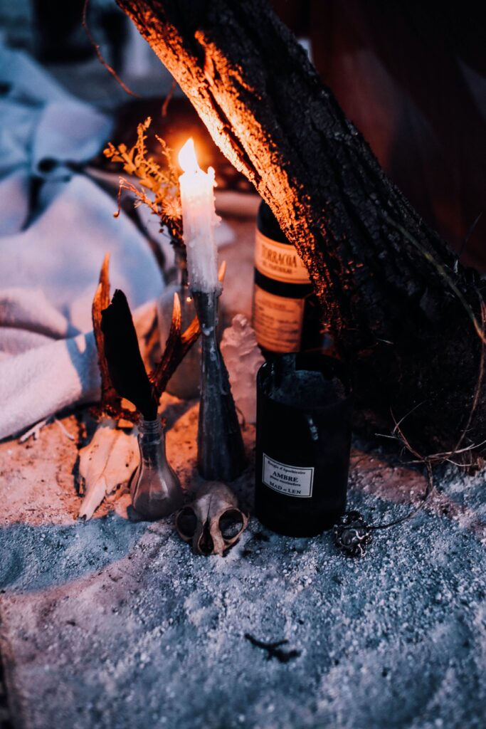 Alcohol bottles and candles, all looking a bit sinister - teenage birthday party ideas