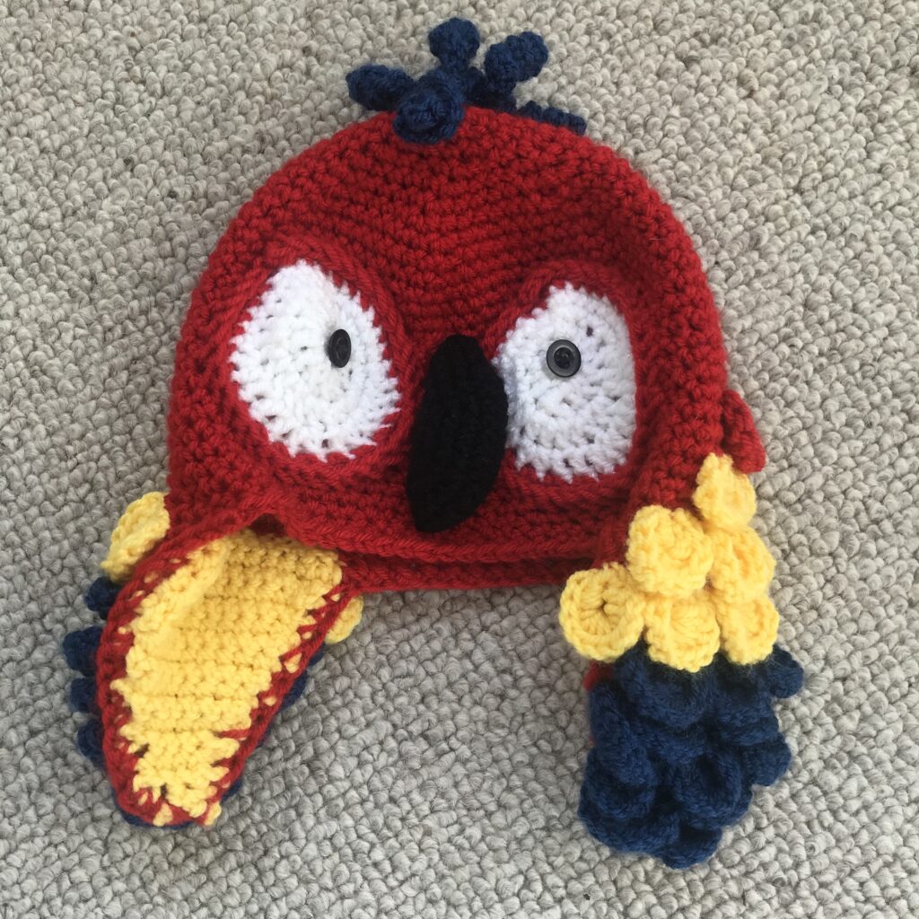 Red, yellow and blue parrot crochet hat