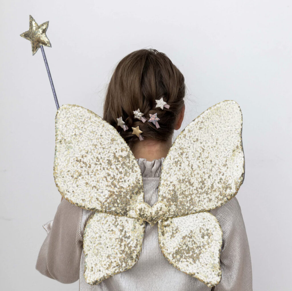 Mimi and lula girl in a gold angel wings