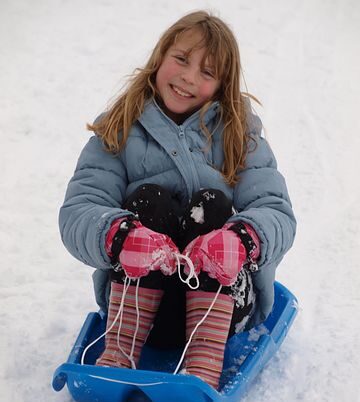 Indoor sledging girl on sledge