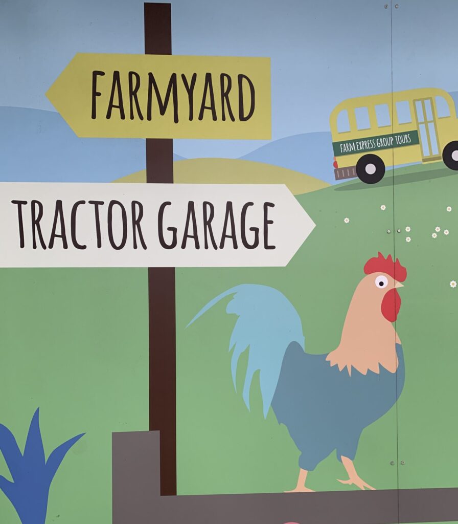 Painting of a tractor garage sign and a chicken