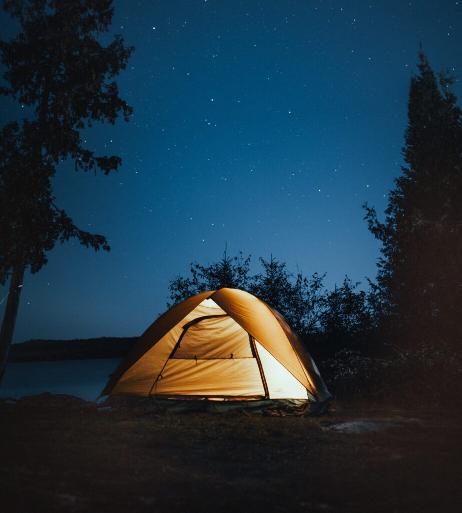A tent all glowing in the dark night - teenage birthday party ideas