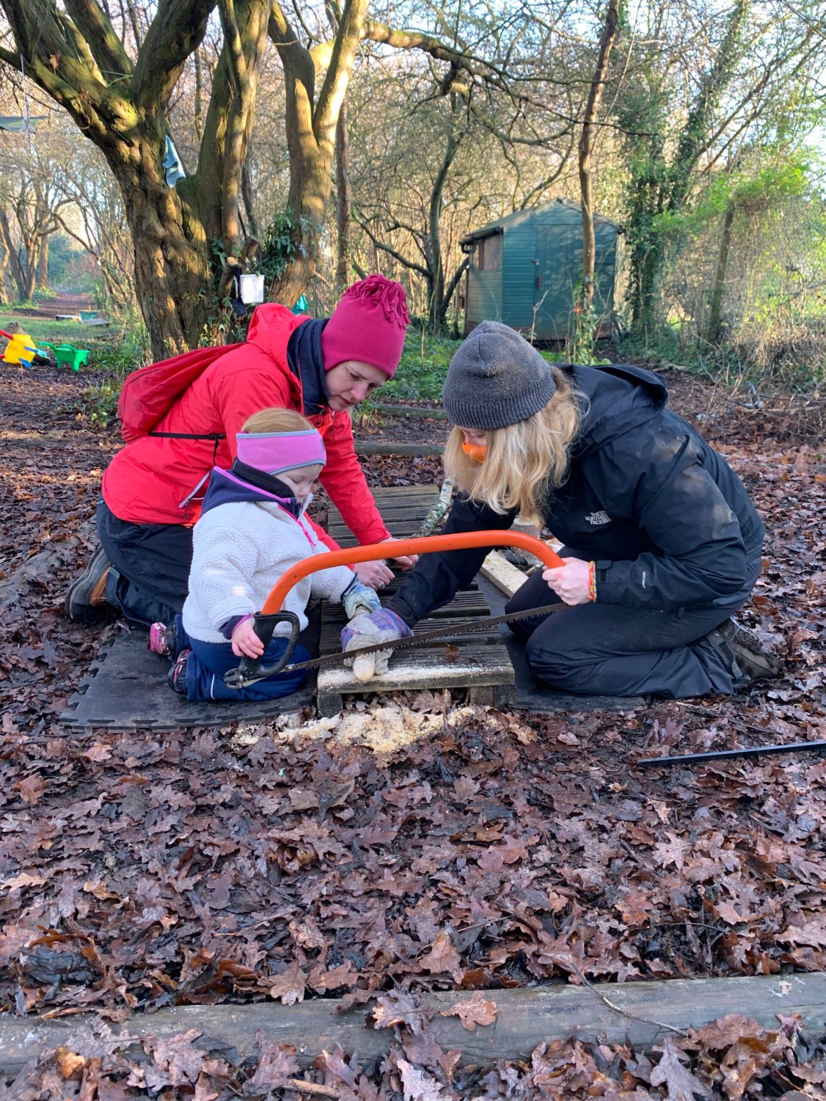 Sawing wood in the forest - Forest school style parties