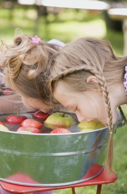 Girls apple bobbing