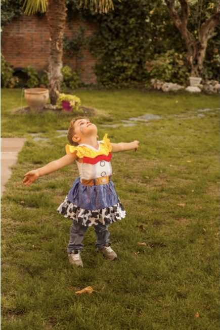 Boy dressed as woody from toy story