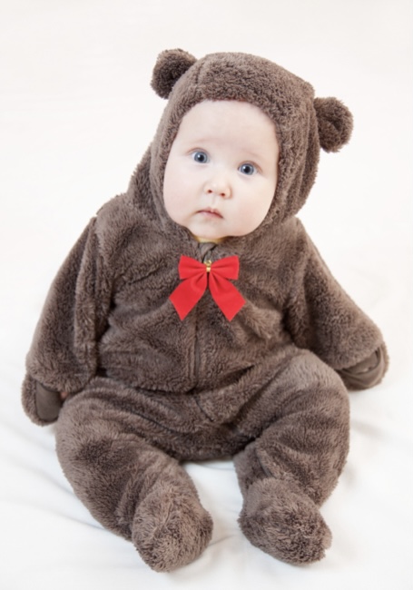 Baby dressed in teddy bear costume