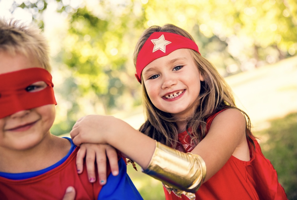 Little kids dressed as super heros