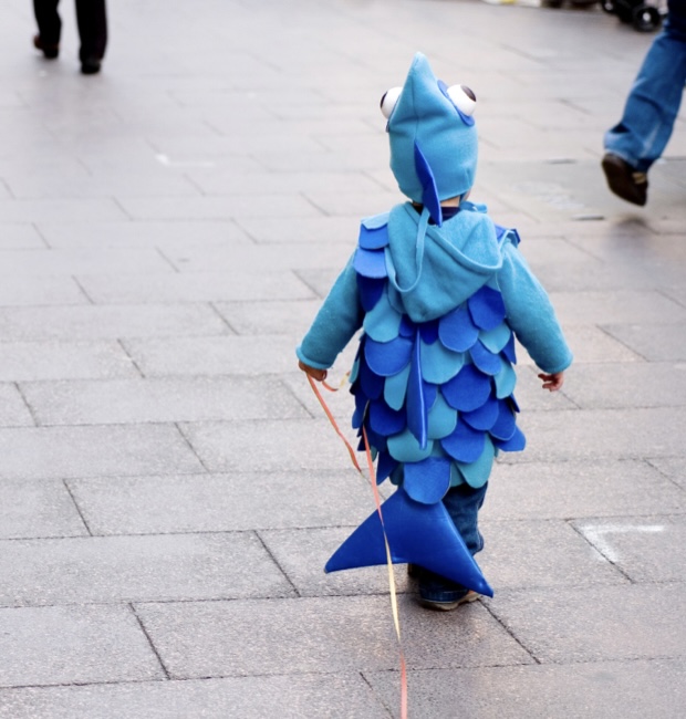 Small child in fish costume