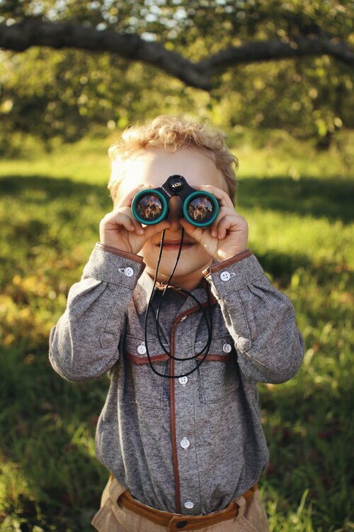 Little boy with binoculars