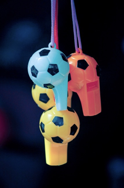 A collection of football shaped whistles
