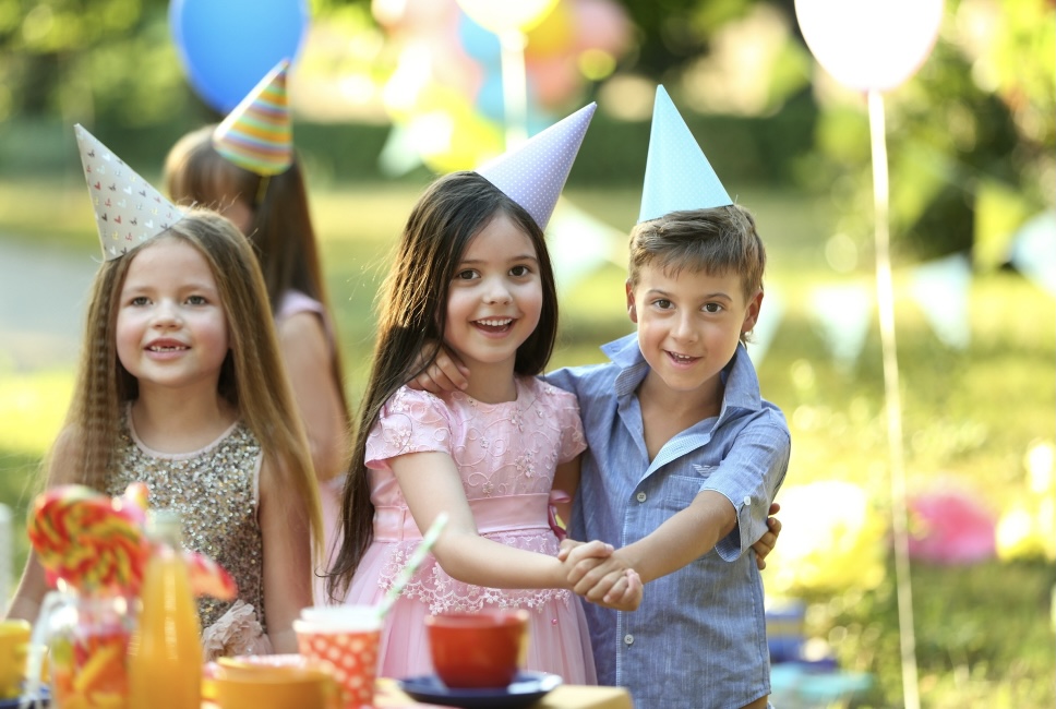 Children dancing at party in the park