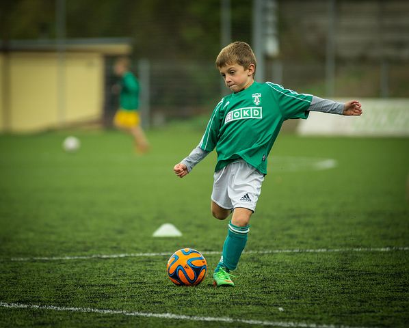 Boy playing football