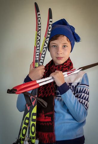 Boy with skis and poles