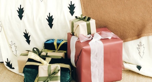 Pile of presents at the end of the bed