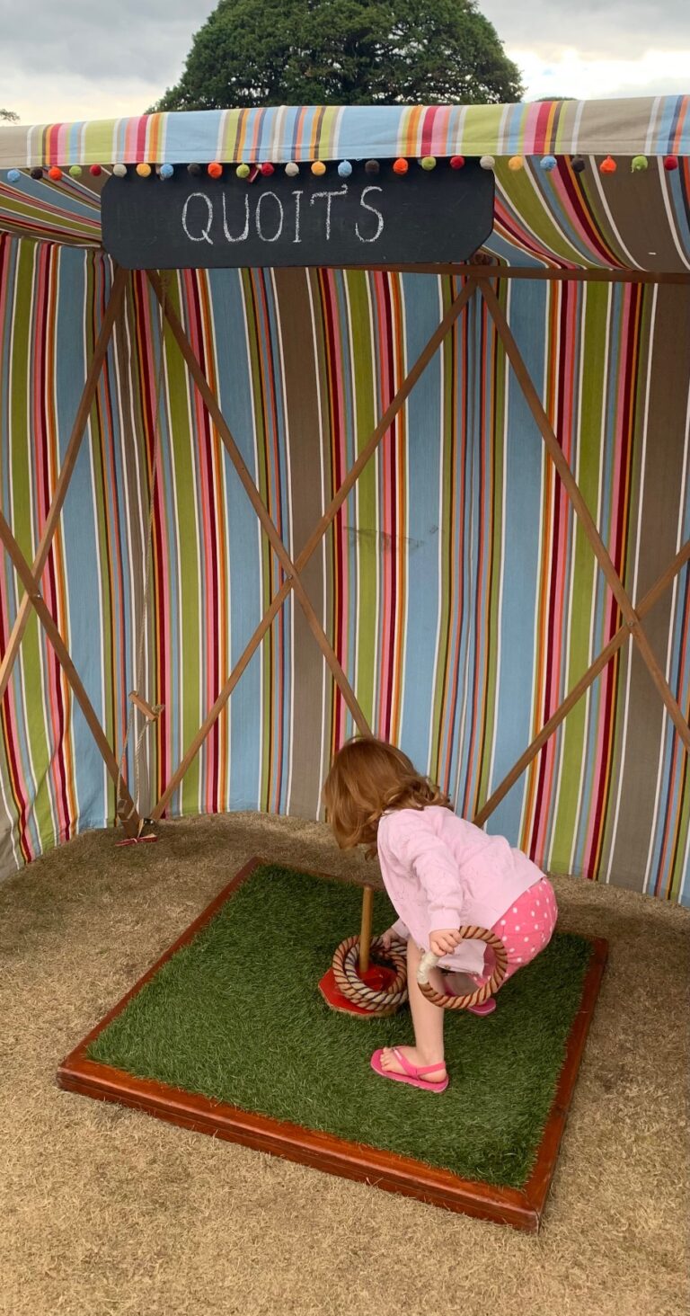 Girl playing hoop-la - Carnival style party games