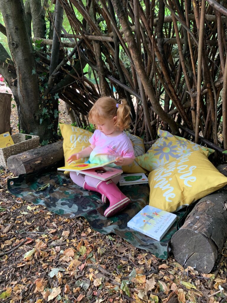 Lily in the reading corner - Forest school style parties