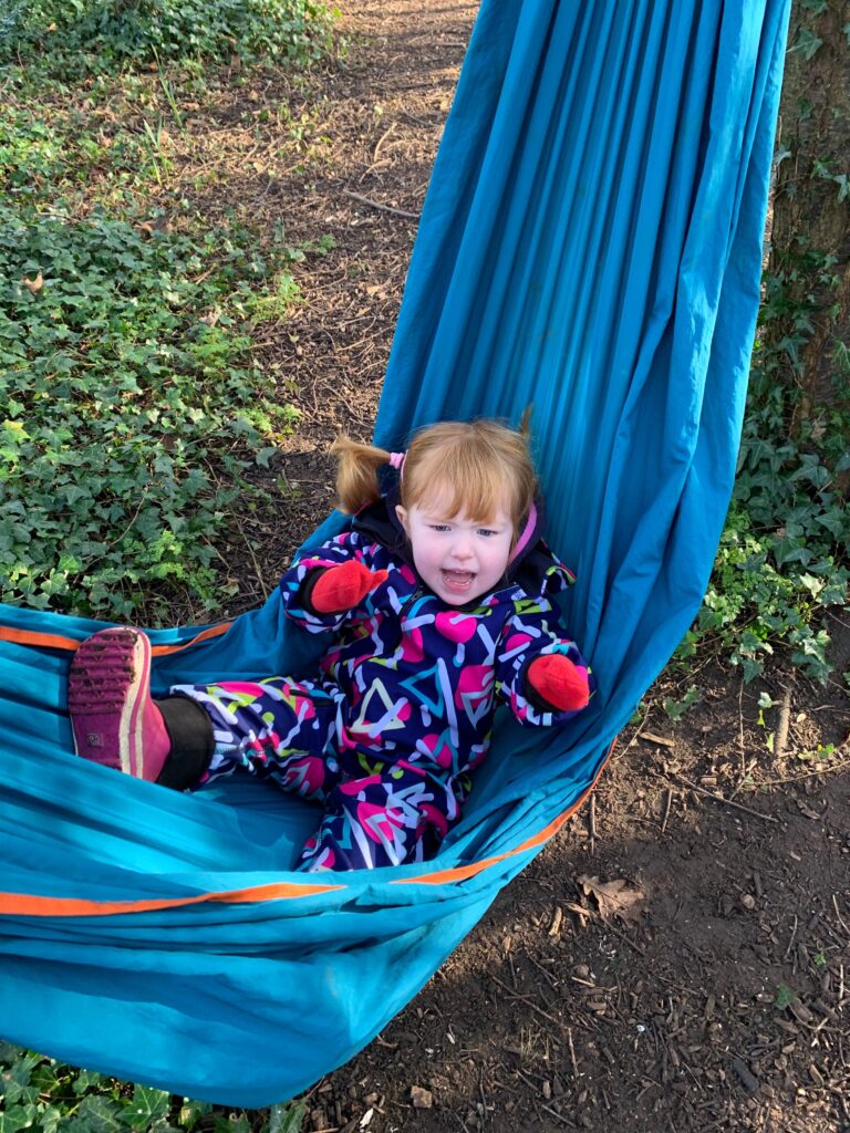 Lily chilling in hammock - Forest school style parties