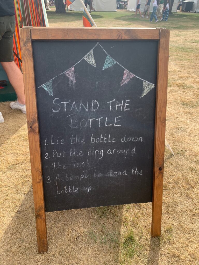 Stand the bottle blackboard - Carnival style party games
