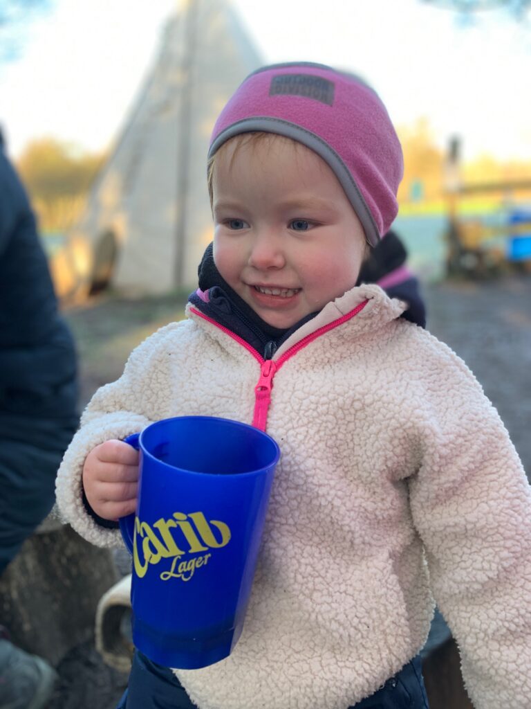 Lily drinking hot chocolate - Forest school style parties